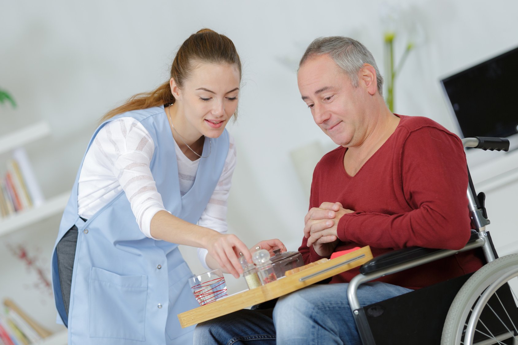 Staff member supporting resident with daily activities